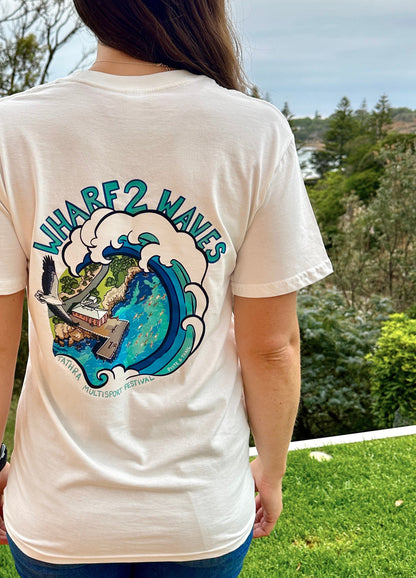 Person wearing a white t-shirt with a graphic design outdoors